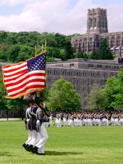 Color guard in parade; chapel